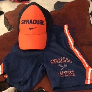 Syracuse hat and lacrosse shorts.